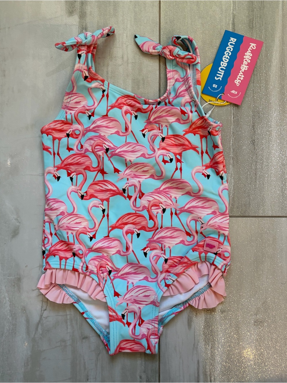 NWT RuffleButts Tropical Fab Flamingo Tie Shoulder One-Piece Swimsuit Girls 2T